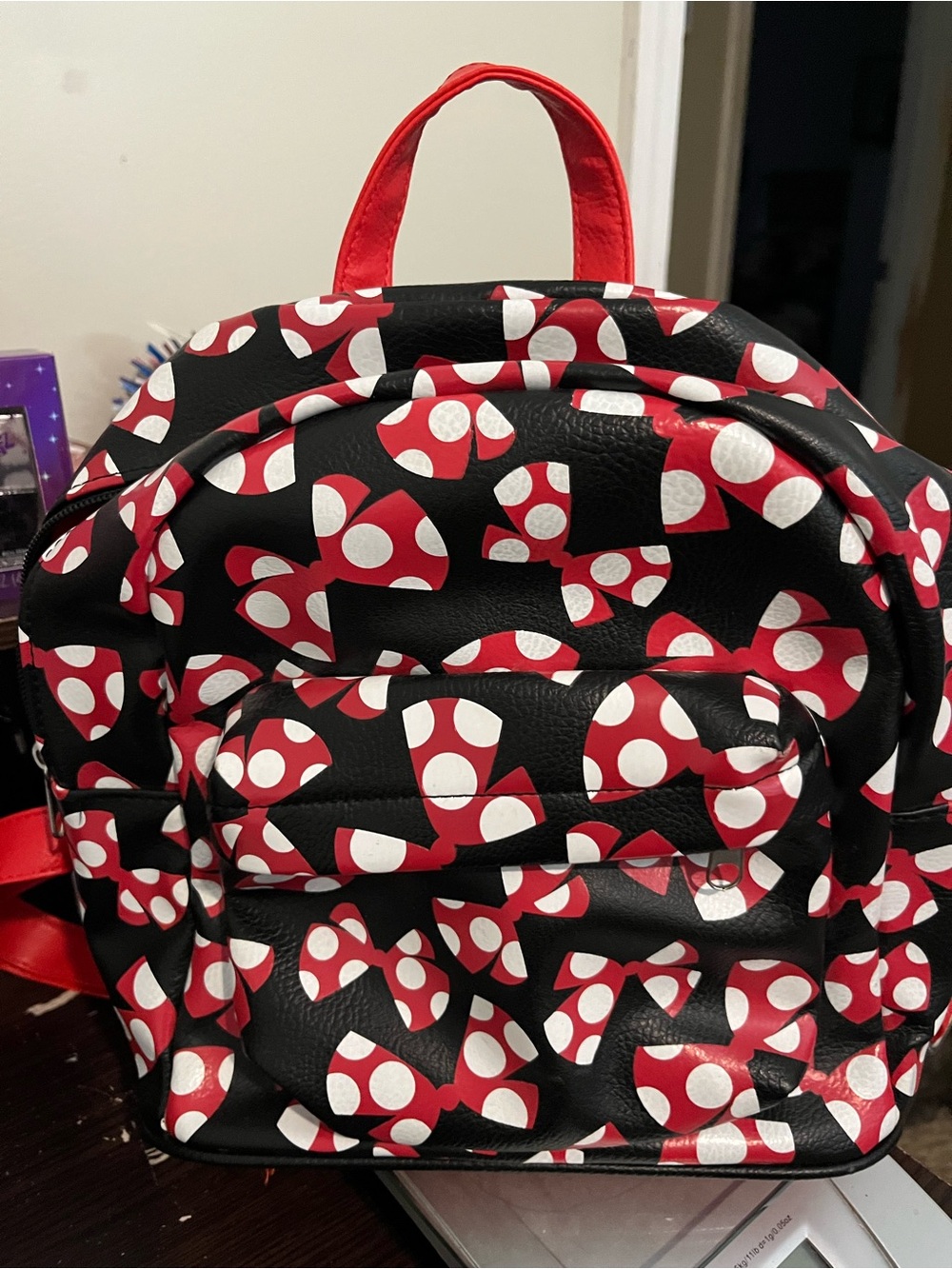 Disney Black Backpack with Red and White Bow Print